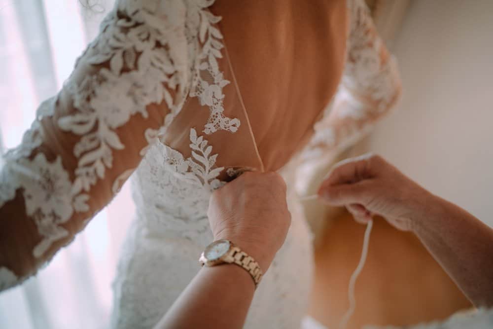 Elegant lace wedding gown with intricate embroidery for a luxury wedding ceremony.