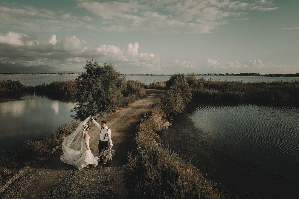 Beautiful outdoor wedding scene by serene water for a luxurious wedding celebration.