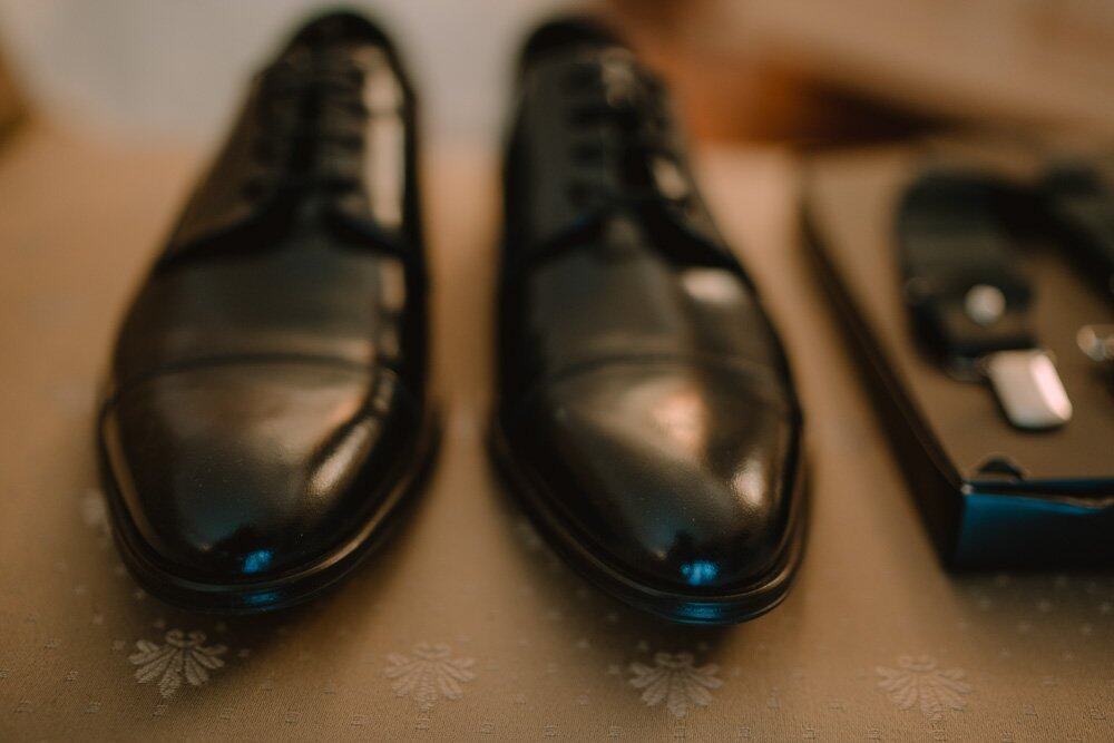 Elegant black leather dress shoes for a luxury wedding.