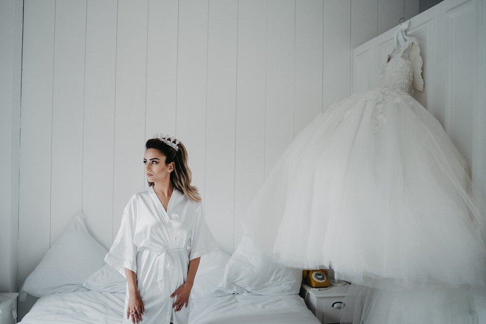 Elegant bride preparing for her luxury wedding in a high-end venue, showcasing sophistication and style.
