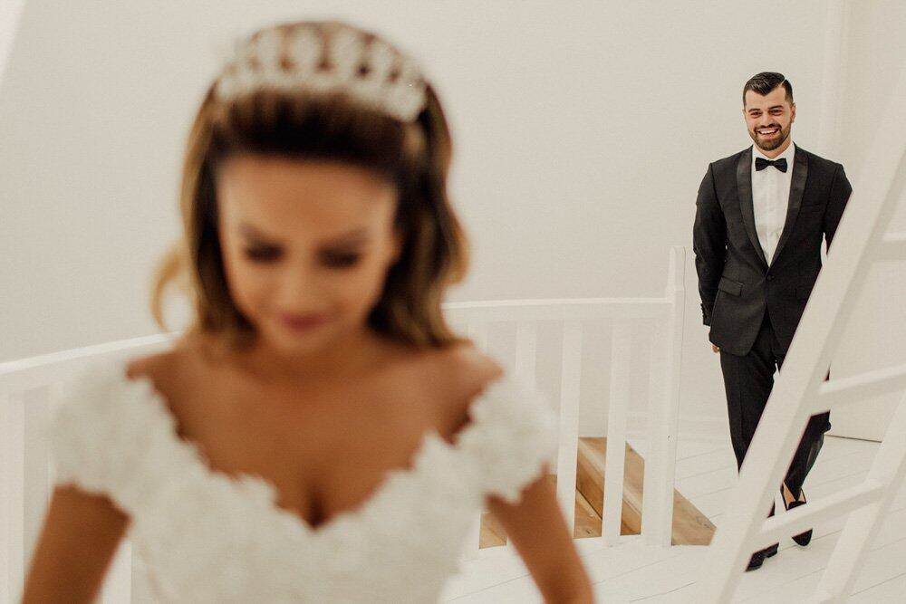 Elegant bride and groom preparing for a luxury wedding, showcasing high-end venue details and romantic atmosphere.