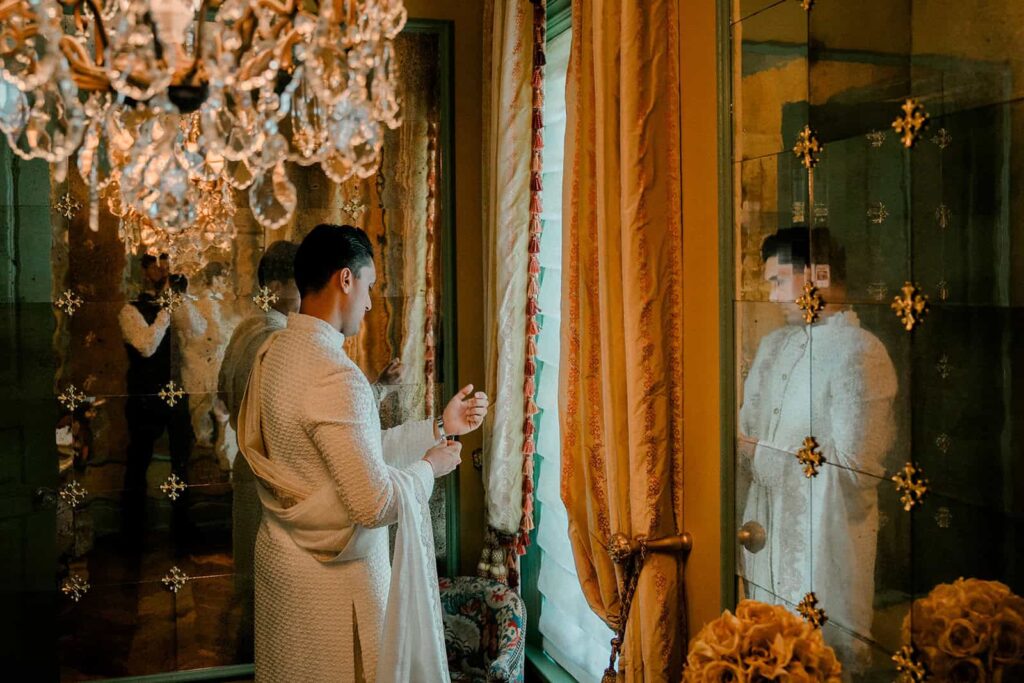 Luxury wedding bride preparing in elegant high-end venue with ornate decor and rich fabrics.