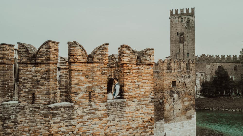Luxury wedding photos at historic castle with romantic couple, high-end venue, elegant celebration, scenic backdrop, vintage architecture, special event, outdoor wedding, timeless ambiance.