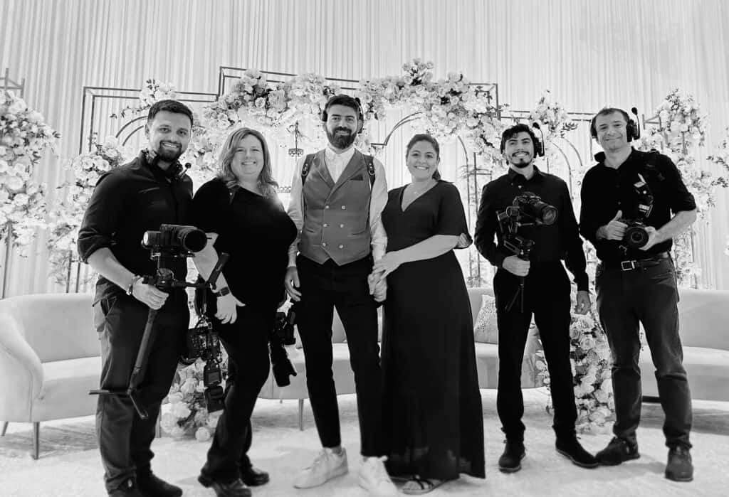 Elegant wedding photography team capturing a luxurious wedding celebration in a high-end venue, showcasing professionalism and exquisite event planning.