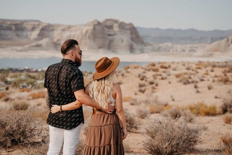 Beautiful couple in desert landscape, romantic wedding scene with high-end scenic backdrop.