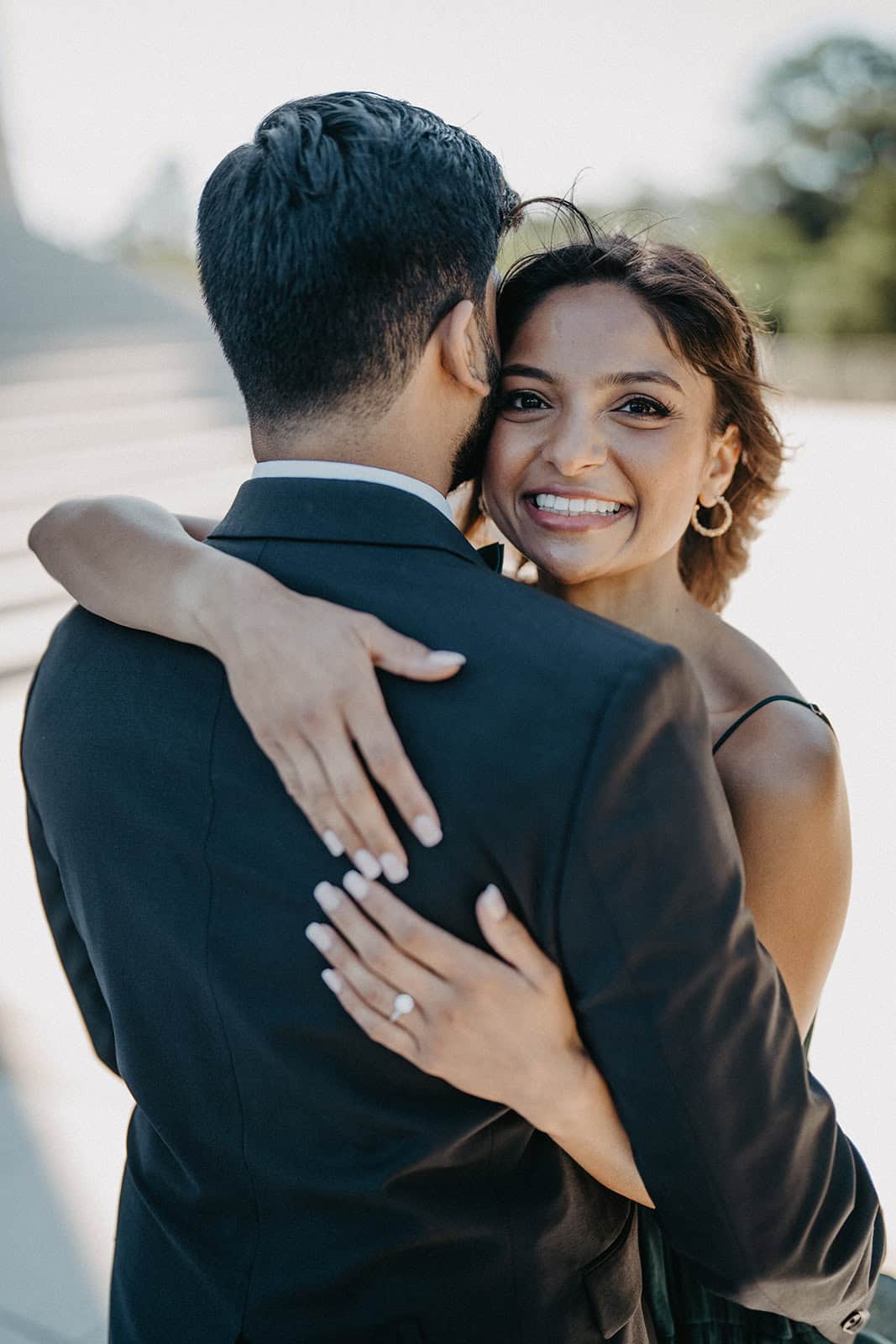 A young couple embracing outdoors, celebrating their wedding day with love and happiness.