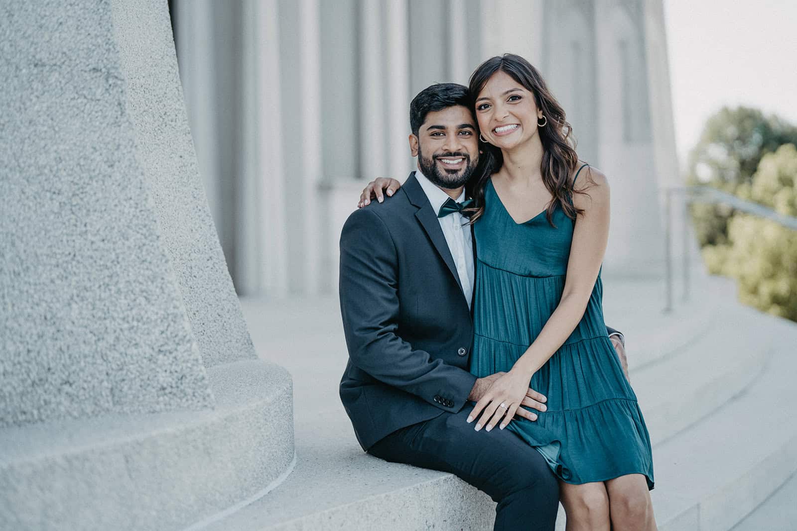 Elegant couple in formal attire at a luxurious outdoor venue, perfect for high-end wedding photography.